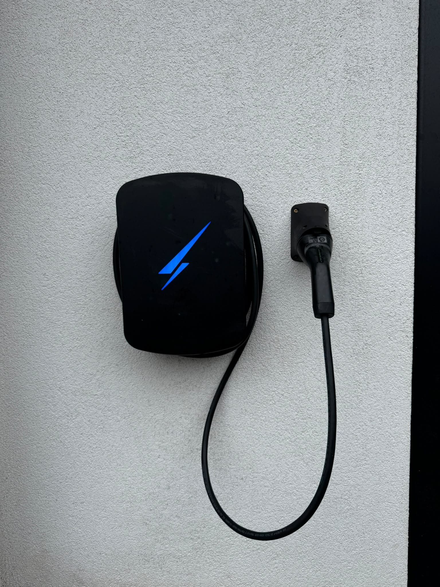 Evans All Electrical ev charger black on white render wall